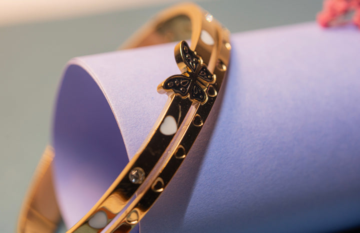 Gold Butterfly and Heart Bracelet.