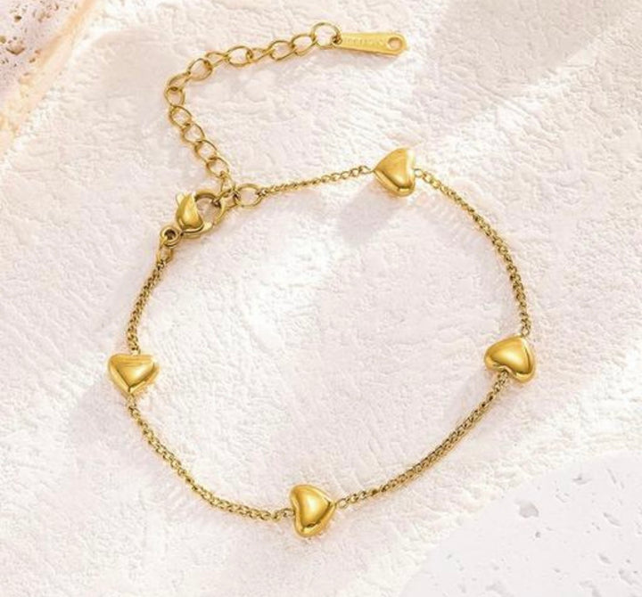 Gold Heart Charm Station Bracelet.