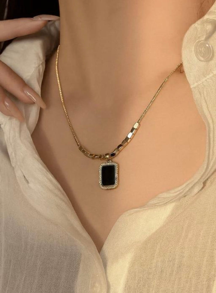 Black Rectangular Onyx Pendant with Gold Cube Accents on a Snake Chain